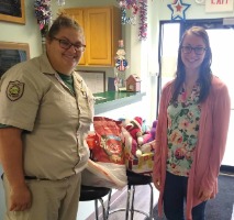 Employee donating supplies at animal shelter